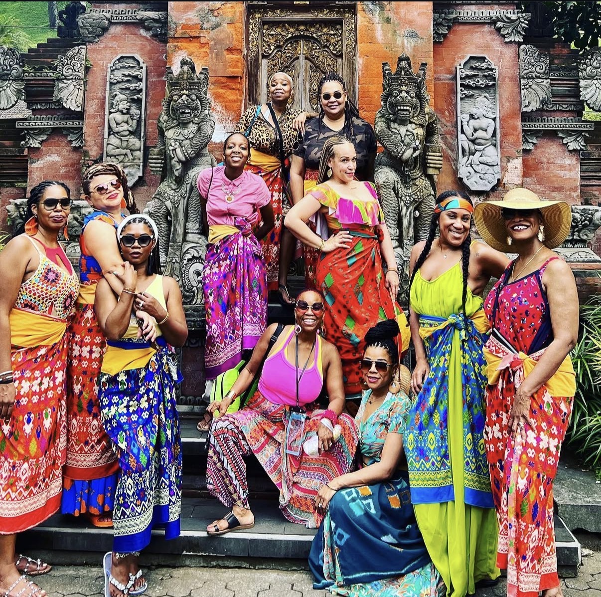 Escape with MJ Travel group in traditional Balinese attire at a temple